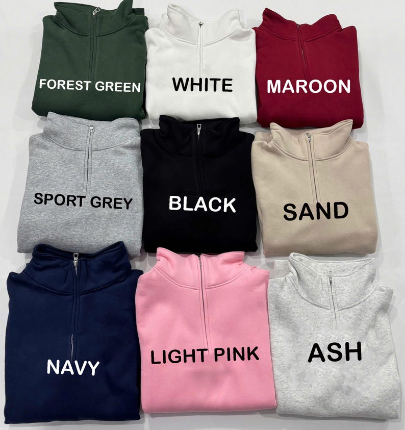 May include: A set of three ceramic mugs with a speckled, matte finish. The mugs are in shades of cream, light gray, and dark gray. Each mug has a simple, minimalist design and a rounded handle.