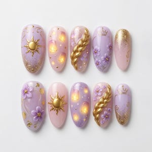 May include: A set of ten artificial nails with a fairytale theme. Designs include gold suns, lanterns, flowers, a gold braid, and crowns. The nails are painted in shades of pink, purple, and gold.