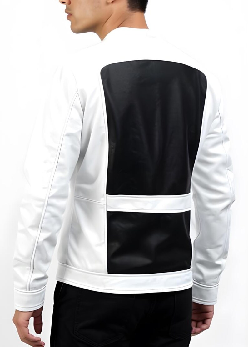 May include: White and black jacket with a modern design. The jacket features a white body with a large black panel on the back and a horizontal black panel on the lower back. The jacket has a stand-up collar and long sleeves.