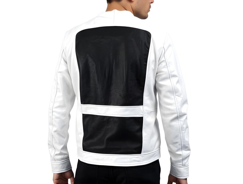 May include: A white jacket with a black panel on the back. The jacket has a stand-up collar and long sleeves. A horizontal white stripe accents the black panel. The jacket appears to be made of a leather-like material.