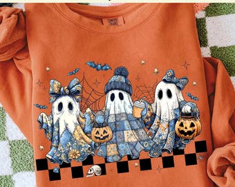 May include: Orange sweatshirt with a DTF transfer of three cartoon ghosts holding jack-o'-lanterns, with bats and spiderwebs. The ghosts wear hats and bows, with a blue and floral pattern. The text at the top says "Ready to Press DTF Transfer".