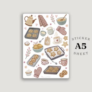 Könnte beinhalten: A5-Stickerbogen mit Illustrationen zum Thema Backen. Enthält Kekse, Cupcakes, eine Teekanne, Ofenhandschuhe und Kaffeetassen. Der Bogen trägt den Text "Sticker Sheet A5".