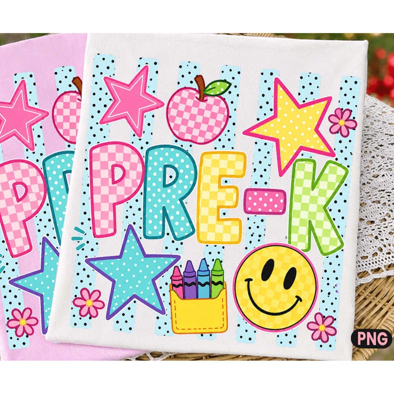May include: A white fabric square featuring the text PRE-K in colorful checkered letters, surrounded by a pink checkered apple, a yellow star, a yellow smiley face, small flowers, and a yellow pocket containing four colorful crayons.