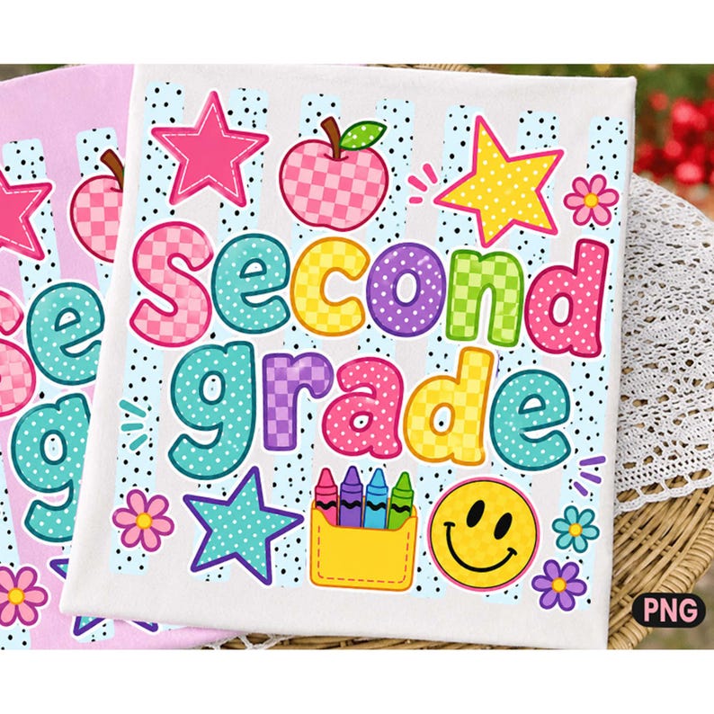 May include: A white fabric square featuring the text Second grade in colorful, patterned bubble letters. The design includes a pink checkered apple, yellow and pink stars, a yellow smiley face, a yellow crayon box, and small flowers.