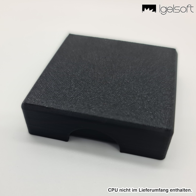 May include: A black, rectangular box with a textured surface. The box has a slot cut out on one side. The image also includes the text "CPU nicht im Lieferumfang enthalten."