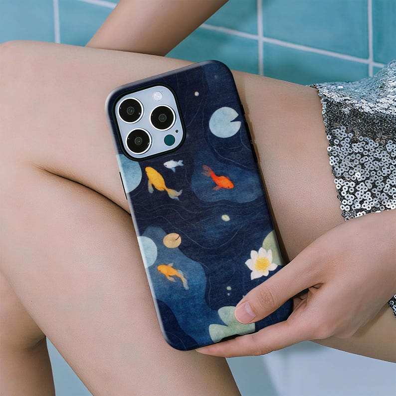 This Koi Fish phone case blends traditional Japanese culture with aquatic aesthetics, featuring lifelike koi fish swimming across a flowing water background, symbolizing good luck and prosperity. The soft, layered colors bring an elegant and artistic touch to your phone. Slim, lightweight, and durable, it protects your device from drops and scratches while maintaining style.