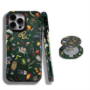 May include: A dark green phone case and matching pop socket featuring a detailed pattern of various insects and small creatures. The design includes beetles, worms, and other bugs in a scattered arrangement.