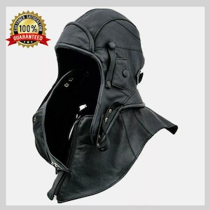 May include: A black leather aviator-style helmet with a zip-up front and button closures. The helmet has a neck guard and ear flaps. The image includes a Customer Satisfaction 100% Guaranteed badge.