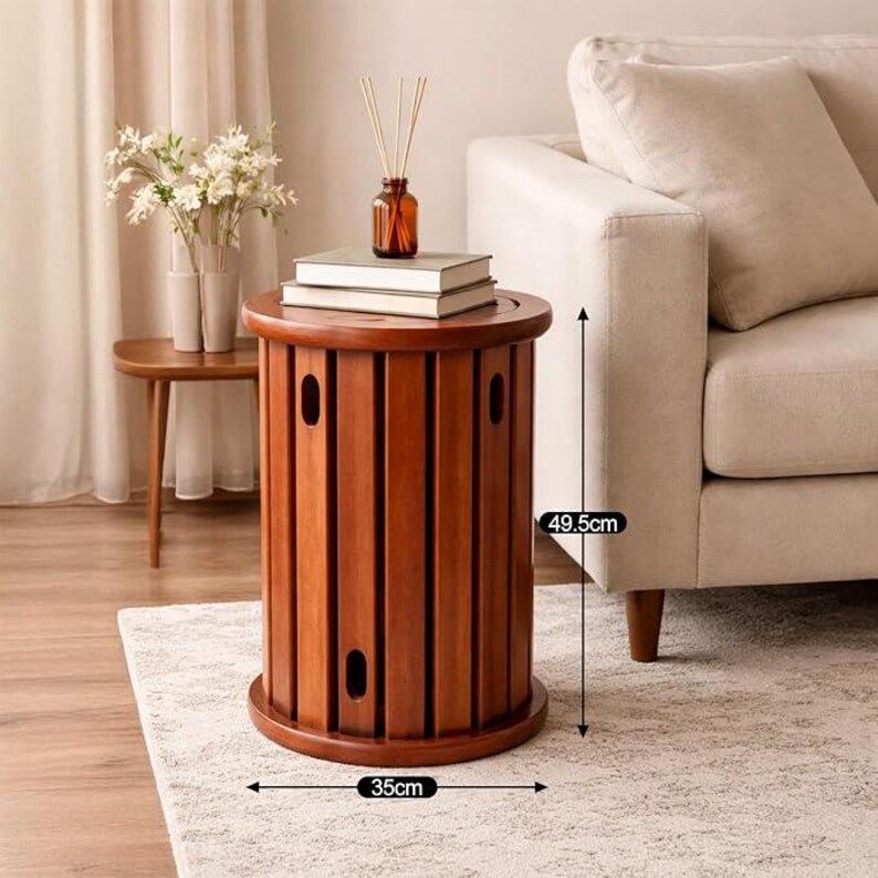 May include: A cylindrical wooden side table with vertical slats and oval cutouts, measuring 49.5 cm in height and 35 cm in diameter. The table features a smooth, warm brown finish and a circular top surface, providing a stable base for small items.