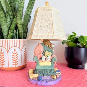 May include: A set of three ceramic mugs with a speckled, matte finish. The mugs are in shades of cream, light gray, and dark gray. Each mug has a simple, minimalist design and a rounded handle. Perfect for coffee or tea.