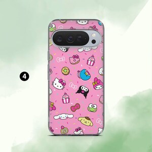 May include: A pink phone case featuring a repeating pattern of cartoon characters, cupcakes, donuts, and bows. The case has a clear border and a camera cutout. The design includes characters like Hello Kitty and My Melody.