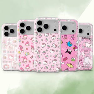May include: Five pink phone cases with various cartoon character designs. The cases feature images of Hello Kitty, strawberries, and other cute illustrations. The cases have a clear border and a gray camera section.