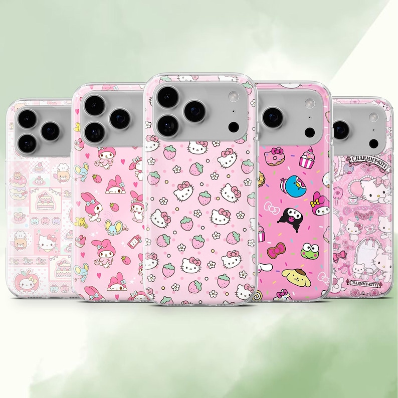May include: Five pink phone cases with various cartoon character designs. The cases feature images of Hello Kitty, strawberries, and other cute illustrations. The cases have a clear border and a gray camera section.
