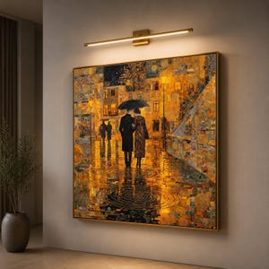 May include: A square wall art print featuring a couple walking under a black umbrella on a rain-slicked street at night. The scene is rendered in vibrant shades of gold, amber, and dark blue, with reflections of city lights in the puddles.