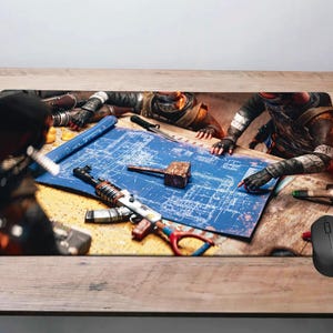 May include: Rectangular mousepad featuring a detailed illustration of a blueprint with weapons and figures. The design includes a hammer, a knife, and a gun. A black computer mouse is on the right side of the mousepad. The color palette includes blue, brown, and black.