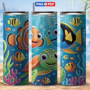 May include: A stainless steel tumbler featuring a vibrant underwater scene with cartoon fish, a sea turtle, and coral. The design includes the text "PNG + PDF" at the top. The tumbler has a straw and is set against a sandy beach background.