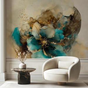 May include: An abstract floral wall art print in shades of teal, gold, and brown. The artwork is displayed above a white chair and a black marble side table with a white vase. The room has a neutral color palette.