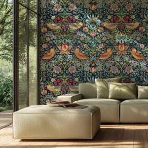 May include: A living room featuring a patterned wallpaper with birds, flowers, and berries in shades of blue, green, and orange. A beige sectional sofa and ottoman are in front of the wallpaper, with a large window to the left.