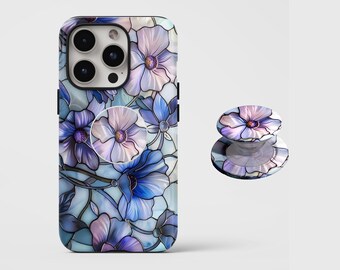 May include: A smartphone case and matching pop-out phone grip with a floral pattern in blue, purple, and white. The case is designed for a smartphone, and the grip is a round accessory.