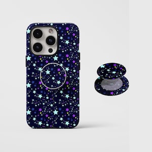 May include: A navy blue phone case and matching pop socket featuring a starry night design with white, purple, and yellow stars. The phone case has a circular pop socket attached.