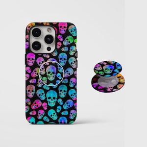 May include: Black phone case and matching pop socket featuring a repeating pattern of colorful skulls. The skulls are in shades of pink, blue, green, and yellow, creating a vibrant and eye-catching design.