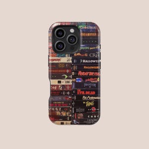 May include: A phone case featuring a collage of vintage VHS tapes. The tapes are stacked vertically, showcasing titles like "Ghostbusters," "Halloween," and "Friday the 13th." The case has a glossy finish and a protective design.