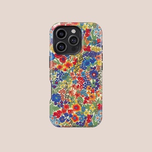Peut inclure: Coque de téléphone à motif floral avec un motif vibrant de fleurs rouges, bleues, jaunes et blanches. L'étui a une finition brillante et une découpe pour l'appareil photo. Le design rappelle une prairie de fleurs sauvages.