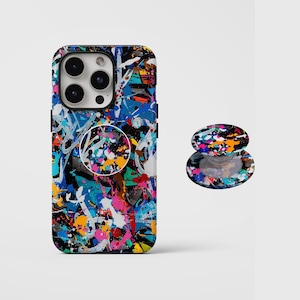 May include: A phone case and matching phone grip featuring a colorful abstract paint splatter design in shades of blue, pink, yellow, and white. The phone case has a black border and a camera cutout.