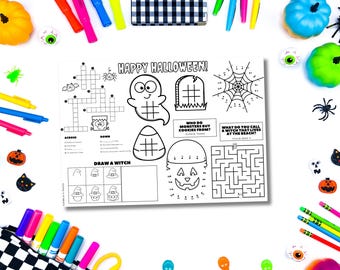 May include: A Halloween-themed activity mat with a crossword puzzle, drawing prompts, and a maze. The mat is surrounded by colorful markers, decorative pumpkins, and Halloween-themed accessories.
