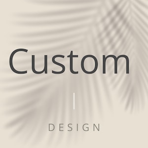 May include: A beige background with a palm leaf shadow overlay. The word "Custom" is in dark gray, centered at the top, with a vertical white line below it. The word "DESIGN" is in gray, centered at the bottom.