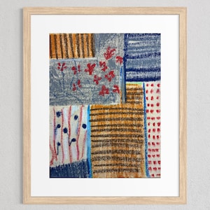 May include: Abstract art print in a light wood frame. The artwork features a patchwork design with various textures and colors, including red floral patterns, blue stripes, and orange and brown horizontal lines.