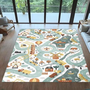 May include: A children's play rug with a road map design. The rug features teal roads, with illustrations of cars, houses, a Ferris wheel, and other playful elements. The background is white with orange and brown accents. The rug is designed for play.