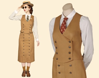 May include: A tan vintage-style suit consisting of a double-breasted vest and a matching skirt. The vest has dark buttons and is paired with a striped shirt and a patterned tie. The outfit is accessorized with a straw hat and sunglasses.