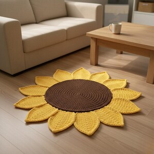 May include: A handmade, crochet sunflower rug with a brown center and yellow petals. The rug is circular and placed on a wooden floor. The rug is a decorative item for a living room.
