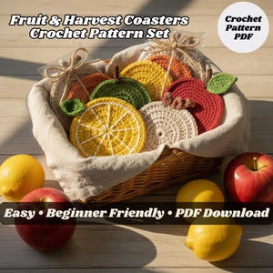 May include: A basket filled with colorful, crocheted fruit-shaped coasters, including a lemon, apple, and orange. The text reads "Fruit & Harvest Coasters Crochet Pattern Set" and "Easy • Beginner Friendly • PDF Download."