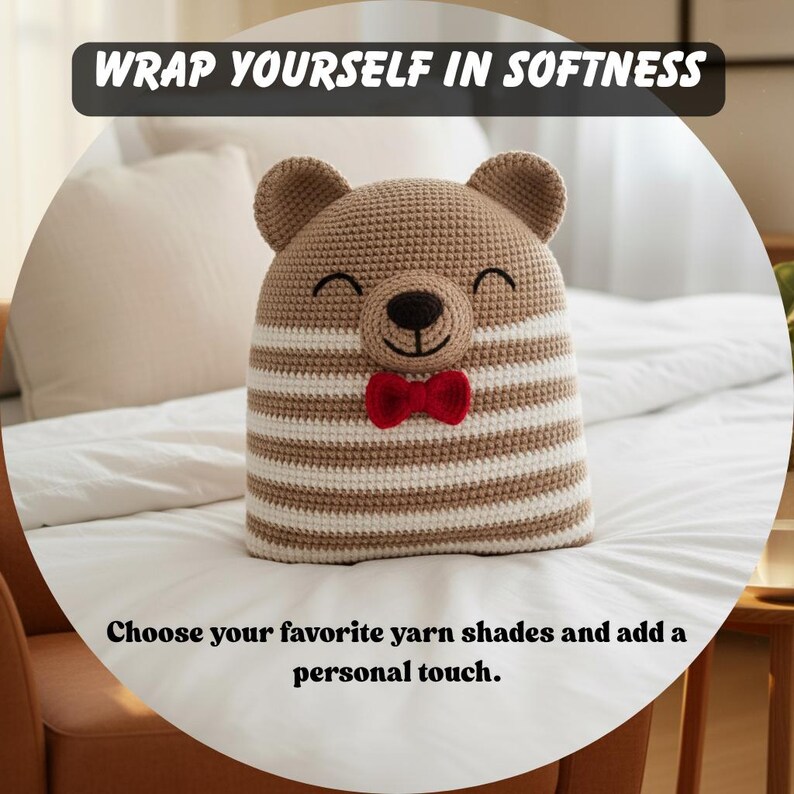 May include: A crocheted bear-shaped pillow with a smiling face and a red bow tie. The bear has brown and white striped body and ears. The text "WRAP YOURSELF IN SOFTNESS" and "Choose your favorite yarn shades and add a personal touch" are displayed.