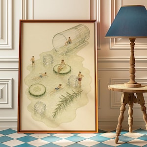 May include: A framed vertical art print featuring a surreal illustration of a spilled glass of liquid. Within the puddle are miniature people swimming, floating on cucumber slices, and standing near ice cubes and a sprig of green rosemary.