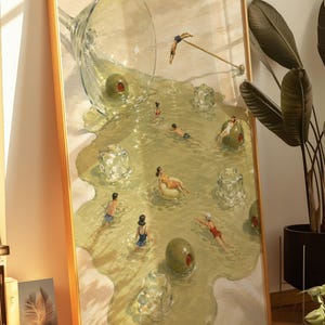 May include: A framed rectangular wall art print featuring a surreal illustration of a spilled martini glass. The liquid forms a pool containing small figures swimming, diving, and floating on ice cubes, with large green olives scattered throughout.