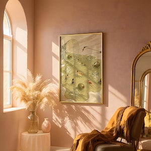 May include: A framed wall art print featuring a surreal illustration of people swimming in a spilled martini glass filled with liquid, ice cubes, and large green olives, all contained within a thin gold-colored metal frame.