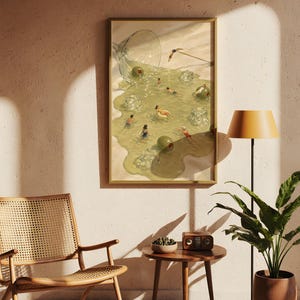 May include: A framed wall art print depicting a spilled martini glass on a sandy surface, with the liquid forming a pool where small figures swim among ice cubes and green olives. The scene features a light green color palette and surreal imagery.