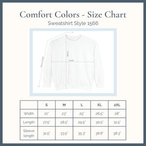 May include: A white Comfort Colors sweatshirt size chart, style 1566, with measurements in inches. The chart includes width, length, and sleeve length for sizes S, M, L, XL, and 2XL. The text "Comfort Colors - Size Chart" is at the top.