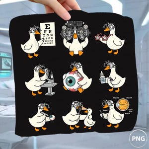 May include: A black fabric square featuring nine cartoon white ducks wearing optometry headgear. The ducks are shown performing various eye exams, holding tools like eye drops, a phoropter, a Snellen chart, and a diagram of the human eye.