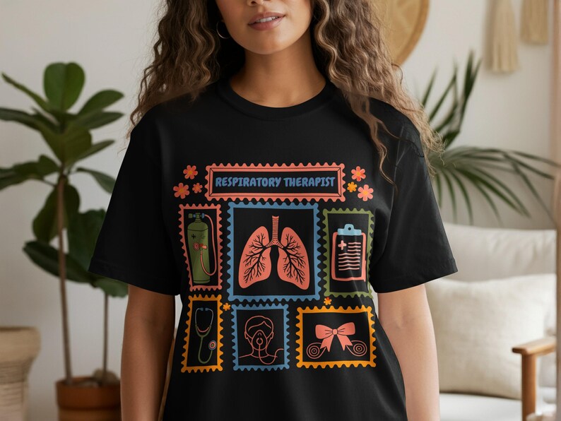 May include: Black t-shirt with a colorful graphic design featuring medical-themed postage stamps. The stamps include images of lungs, a stethoscope, and an oxygen tank. The text "RESPIRATORY THERAPIST" is displayed at the top.