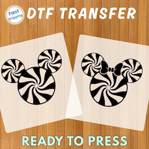 May include: DTF TRANSFER image featuring two designs. One design is a black and white Mickey Mouse head made of swirl candies. The other design is a Mickey Mouse head with a bow. The words "READY TO PRESS" are at the bottom.