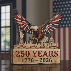 May include: Wooden sculpture of an American bald eagle with outstretched wings, featuring red, white, and blue colors. The sculpture includes the Statue of Liberty, the Capitol building, and the text "250 YEARS 1776-2026".