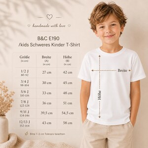 May include: A plain white short-sleeved t-shirt labeled B&C E190. A size chart is displayed to the left, listing widths and heights in centimeters for ages 1/2 to 12/13. The chart includes columns for size, width, and height, with a 1-2 cm tolerance note.