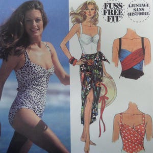 May include: A vintage fashion illustration featuring a woman in a leopard print swimsuit and a drawing of a woman in a white top and floral skirt. Additional drawings show swimsuit designs. The text "Fuss-Free Fit" is visible.
