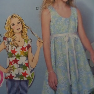 May include: An illustration of a girl wearing a star-patterned top and striped pants. Next to her is a girl wearing a light blue dress with a white ribbon belt. The dress has a floral pattern.