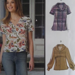 May include: A sewing pattern envelope featuring a short-sleeved blouse with a V-neckline and a floral print. The illustration shows two additional shirt variations: a short-sleeved plaid button-down shirt labeled C and a long-sleeved tan shirt labeled D.