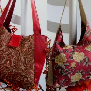 May include: Two shoulder bags labeled A and B. Bag A features a red and brown paisley pattern with solid red side panels and straps. Bag B displays a red fabric with a yellow rose floral print and tan straps, featuring a hobo-style silhouette.